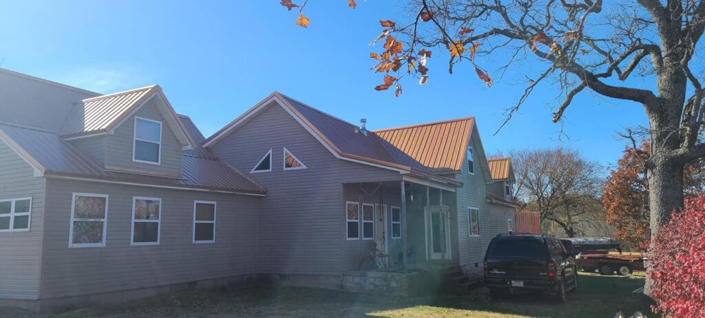 orange metal roof on neighborhood home