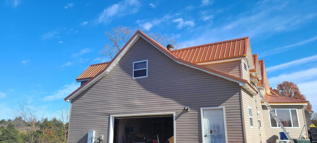 garage view orange metal roof on neighborhood home