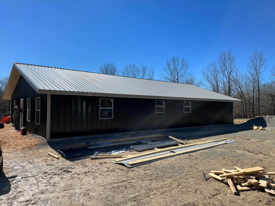 gray roof on black metal building