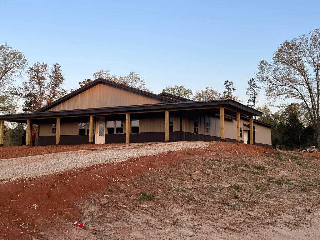 new construction business on hill with wrap around porch