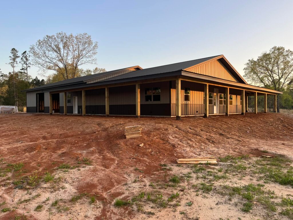 metal home with wrap around porch