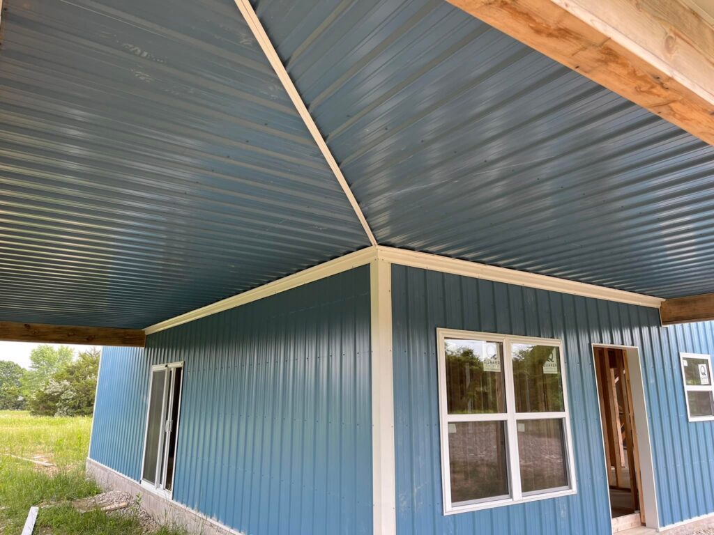 metal building with large covered porch