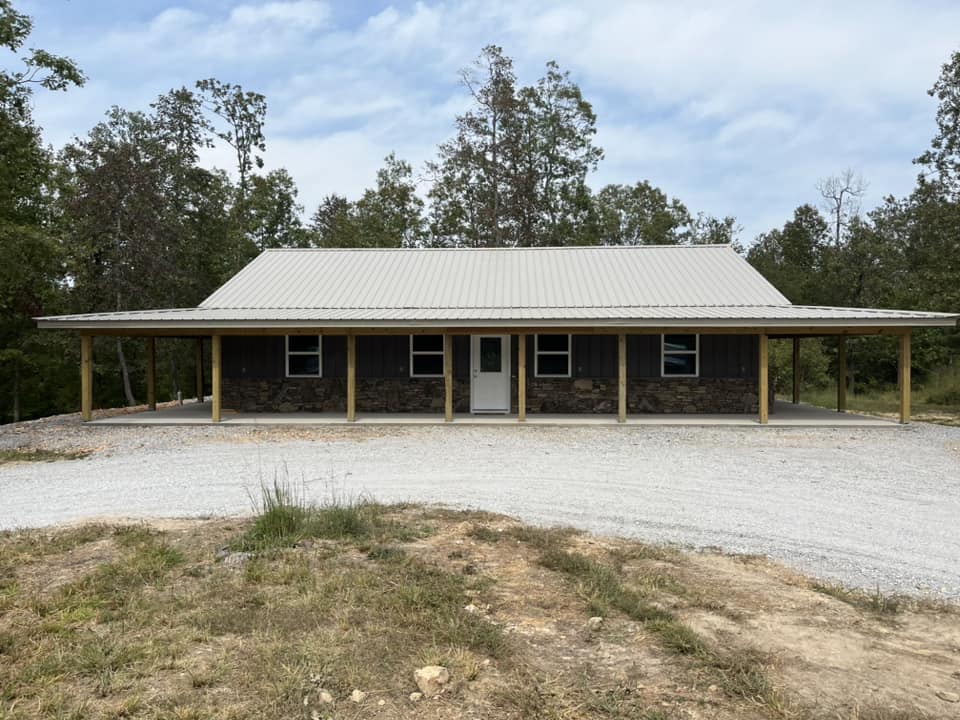 metal roof on home with large wrap around porch