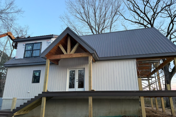 custom metal home with large porch