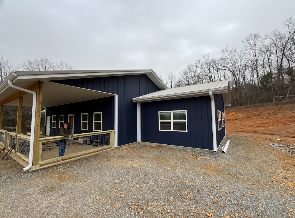 custom metal home with large front porch